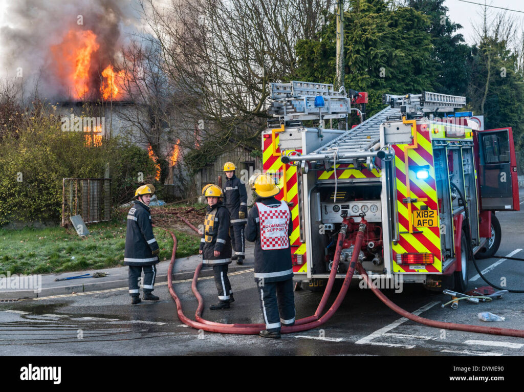 firemen-from-the-welsh-fire-service-attend-a-fire-at-a-derelict-house-DYME90